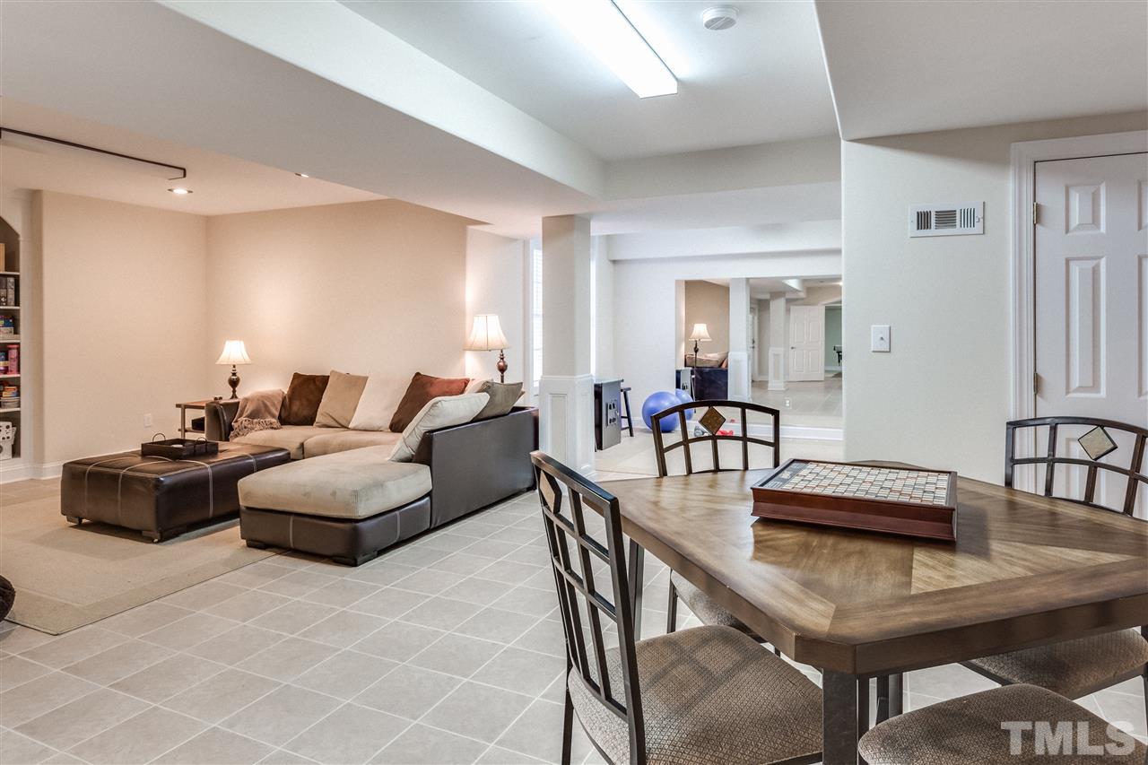 9004 Shellwood Court Raleigh, NC 27617 - Photo 20 of 25 a living room with furniture and wooden floor