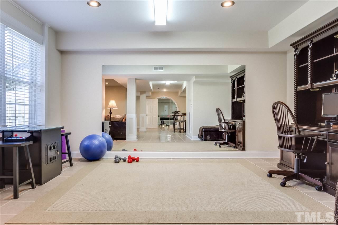 9004 Shellwood Court Raleigh, NC 27617 - Photo 22 of 25 a view of a room with gym equipment