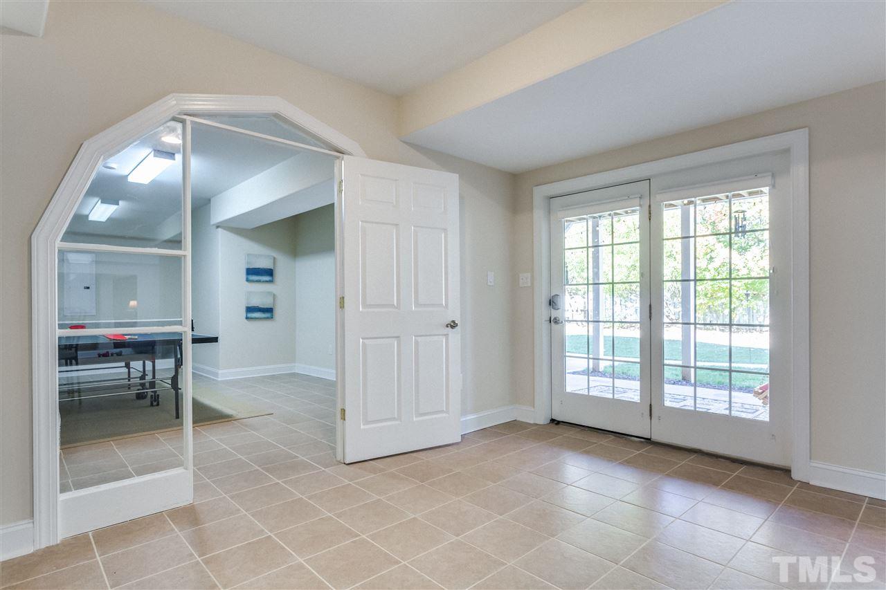 9004 Shellwood Court Raleigh, NC 27617 - Photo 23 of 25 an empty room with windows and a mirror
