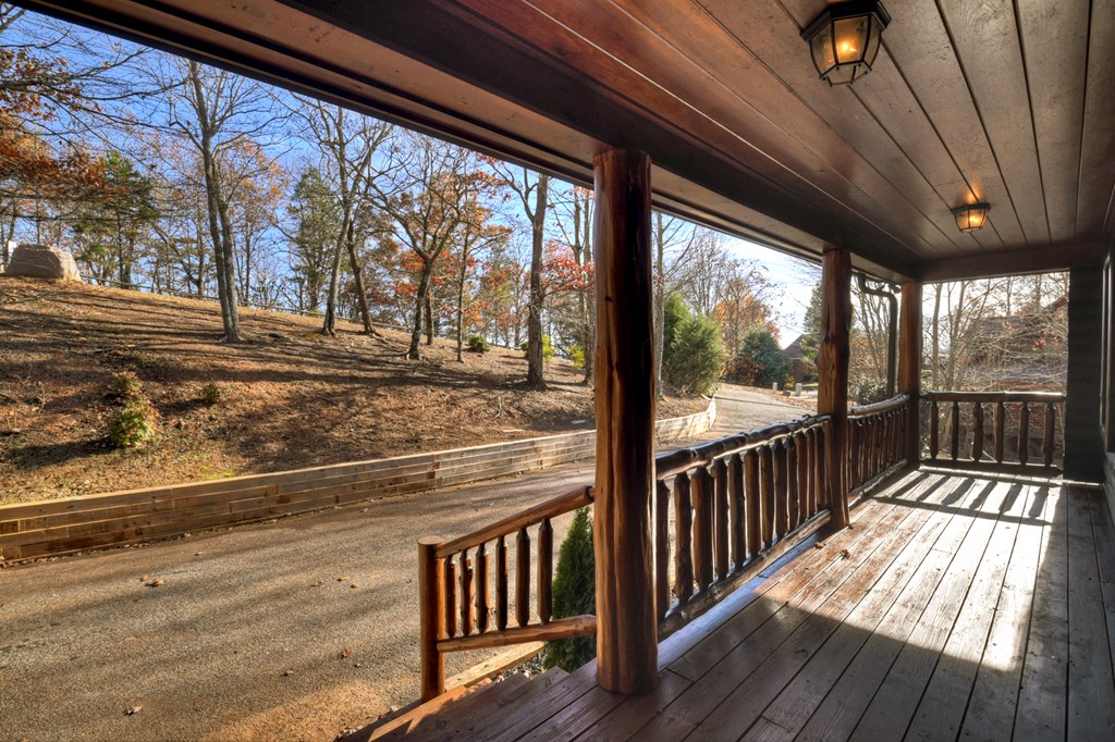 180 Cinnamon Bear Road Mineral Bluff, GA 30559 - Photo 25 of 76 a view of a porch with wooden floor and outdoor space