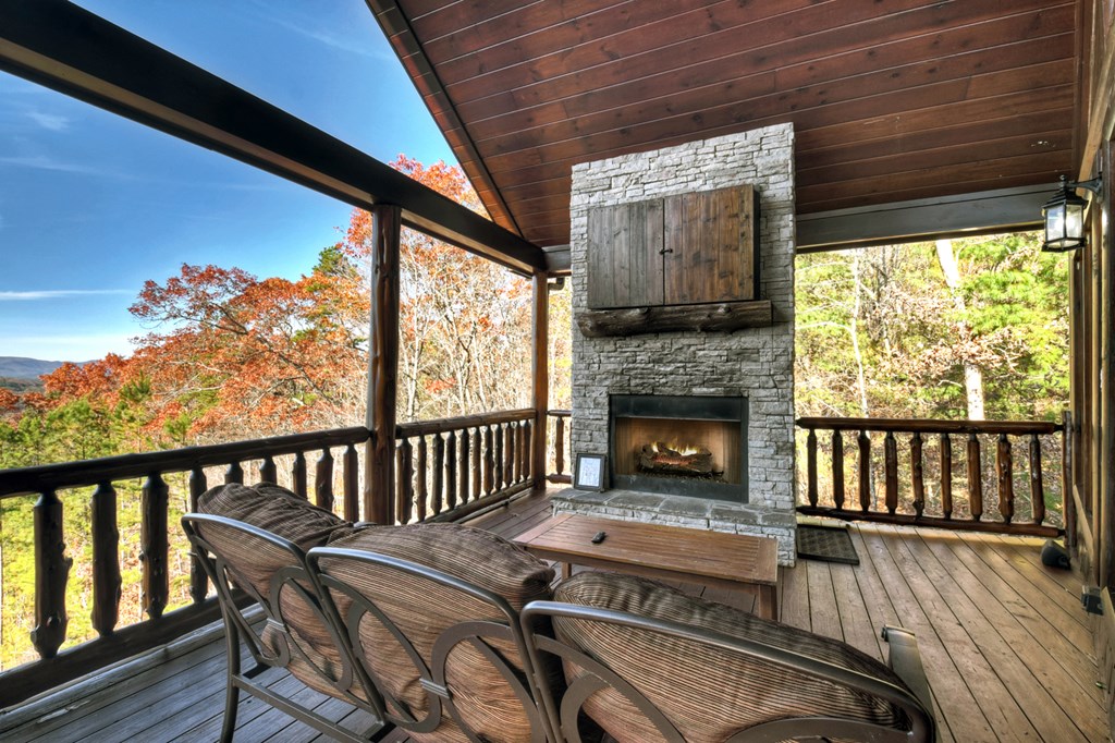 180 Cinnamon Bear Road Mineral Bluff, GA 30559 - Photo 27 of 76 a view of a two chairs in the deck