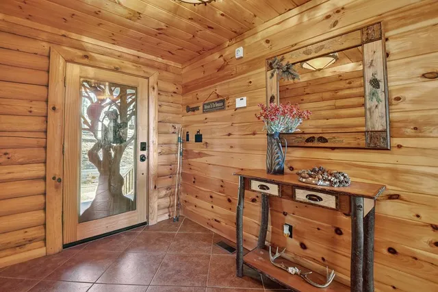 a bathroom with a granite countertop sink mirror and toilet