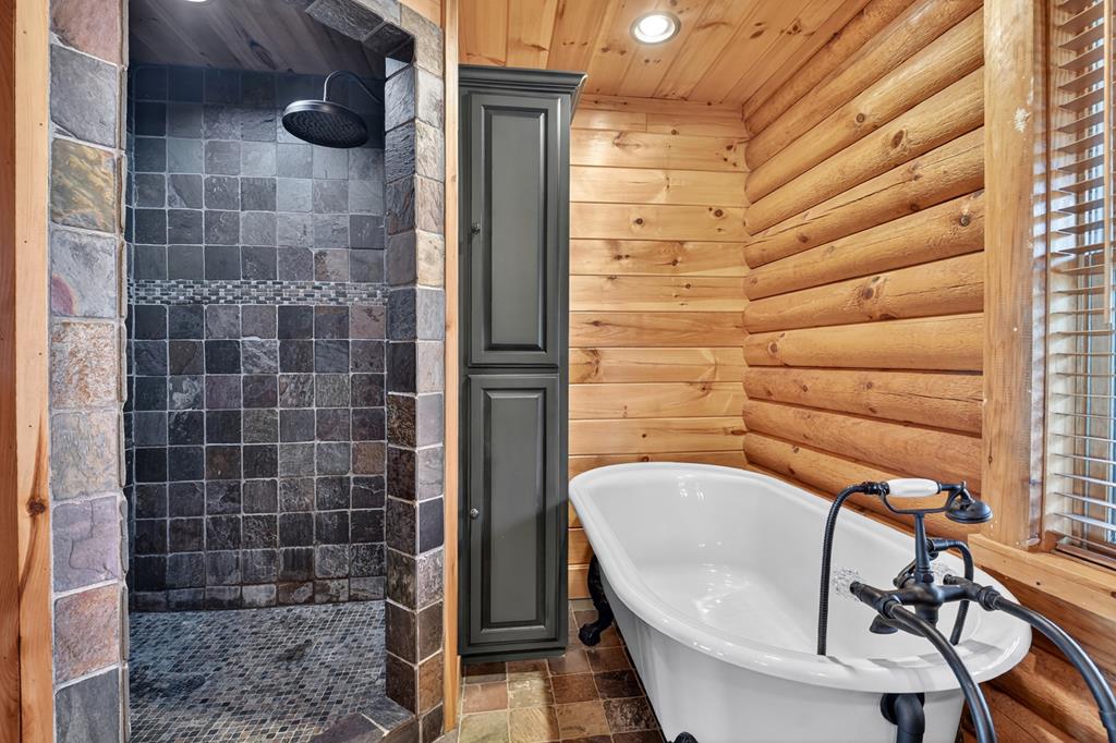 180 Cinnamon Bear Road Mineral Bluff, GA 30559 - Photo 40 of 76 a bathroom with a sink and shower