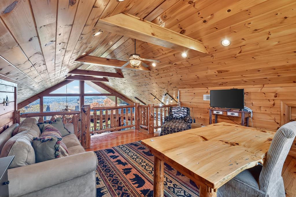 180 Cinnamon Bear Road Mineral Bluff, GA 30559 - Photo 46 of 76 a living room with furniture and a flat screen tv