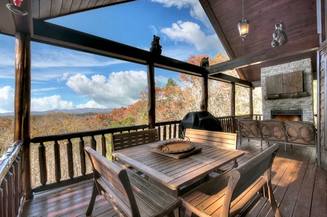 a view of a dining room with furniture a chandelier and wooden floor