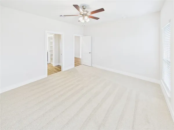 a view of a big room with carpet