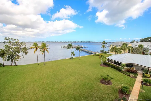 an aerial view of a house with yard swimming pool and outdoor seating