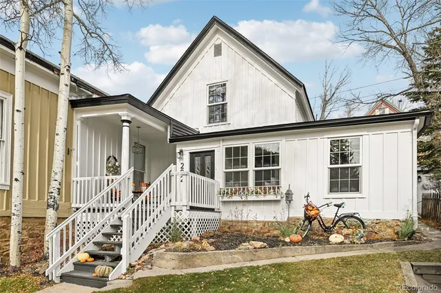 a front view of a house with a small yard