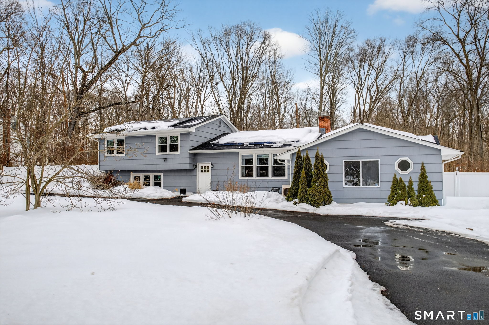375 Sea Hill Road North Branford, CT 06471 - Photo 1 of 40 a front view of a house with a yard covered with snow in front of house
