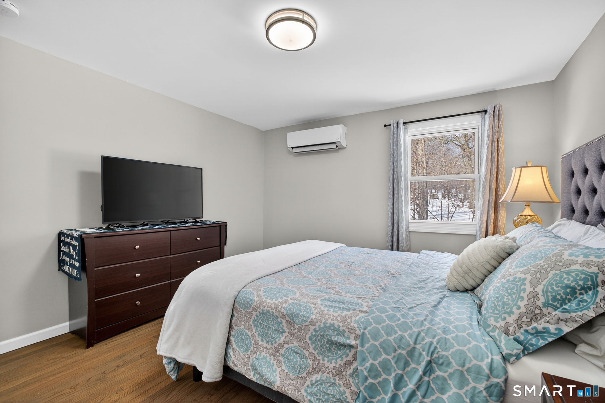 375 Sea Hill Road North Branford, CT 06471 - Photo 21 of 40 a bedroom with a bed and a flat screen tv