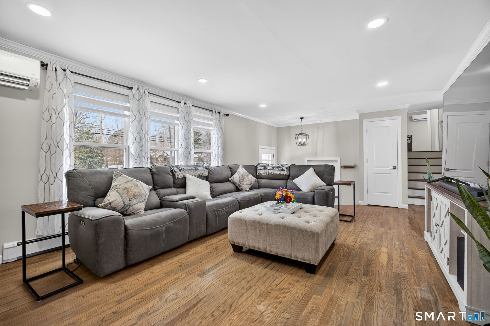 375 Sea Hill Road North Branford, CT 06471 - Photo 5 of 40 a living room with furniture and a flat screen tv