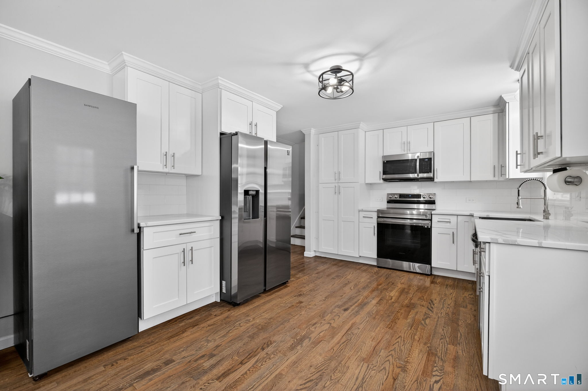 375 Sea Hill Road North Branford, CT 06471 - Photo 9 of 40 a kitchen with stainless steel appliances a refrigerator stove microwave and sink