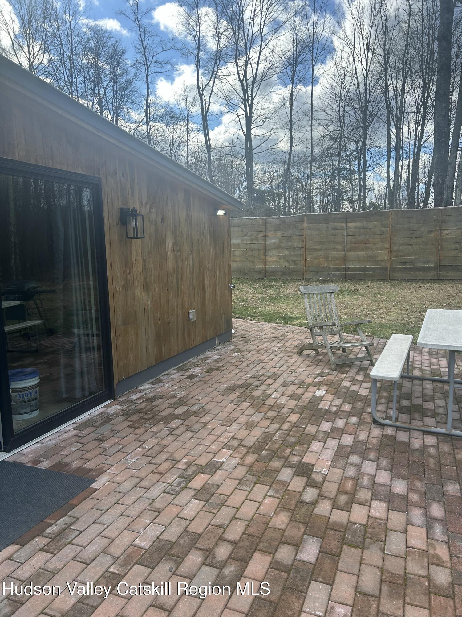 72 Forest Glen Road, Unit STUDIO Gardiner, NY 12561 - Photo 2 of 15 a view of backyard with wooden fence