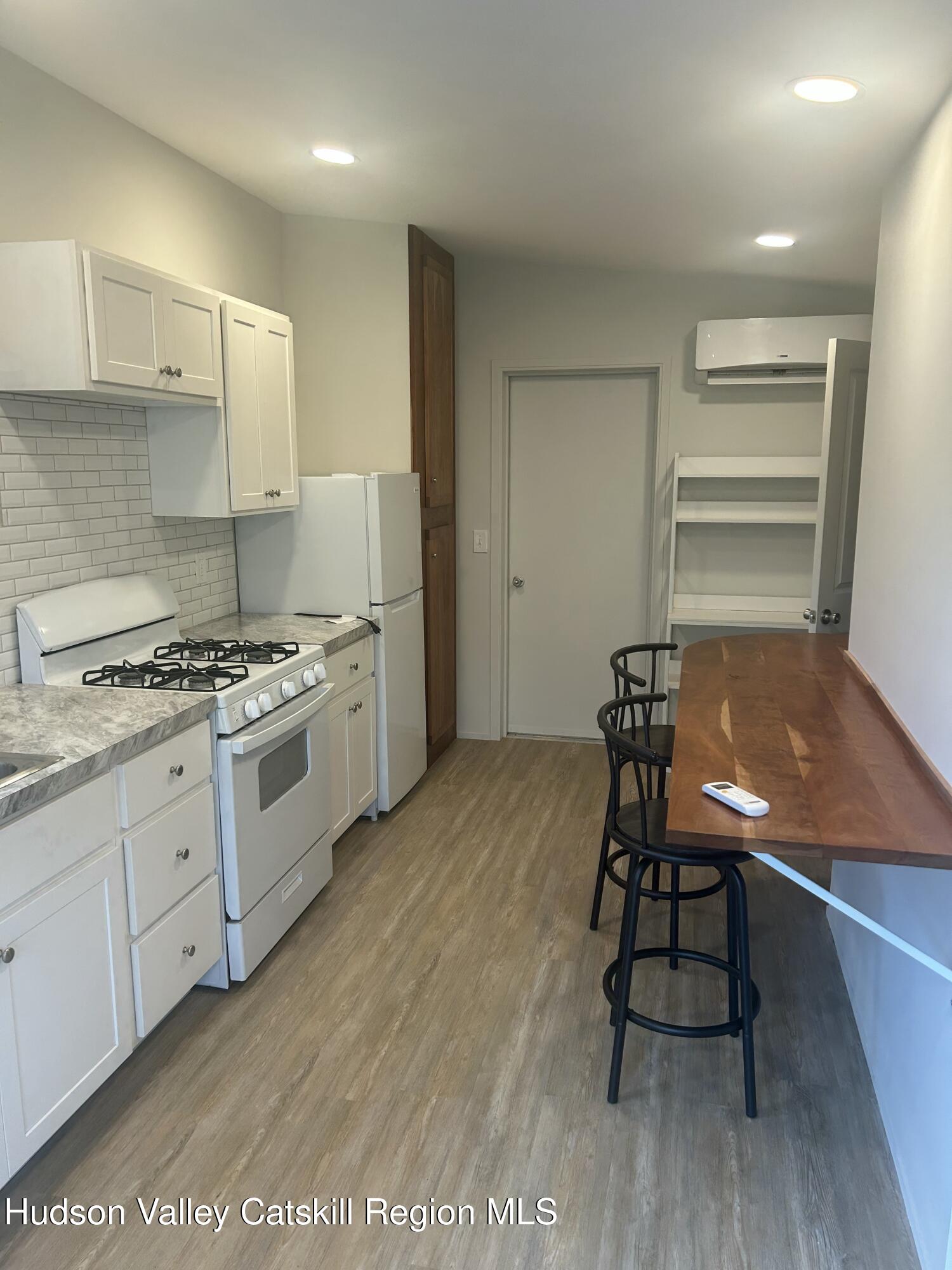 72 Forest Glen Road, Unit STUDIO Gardiner, NY 12561 - Photo 3 of 15 a view of a kitchen with sink table and chairs