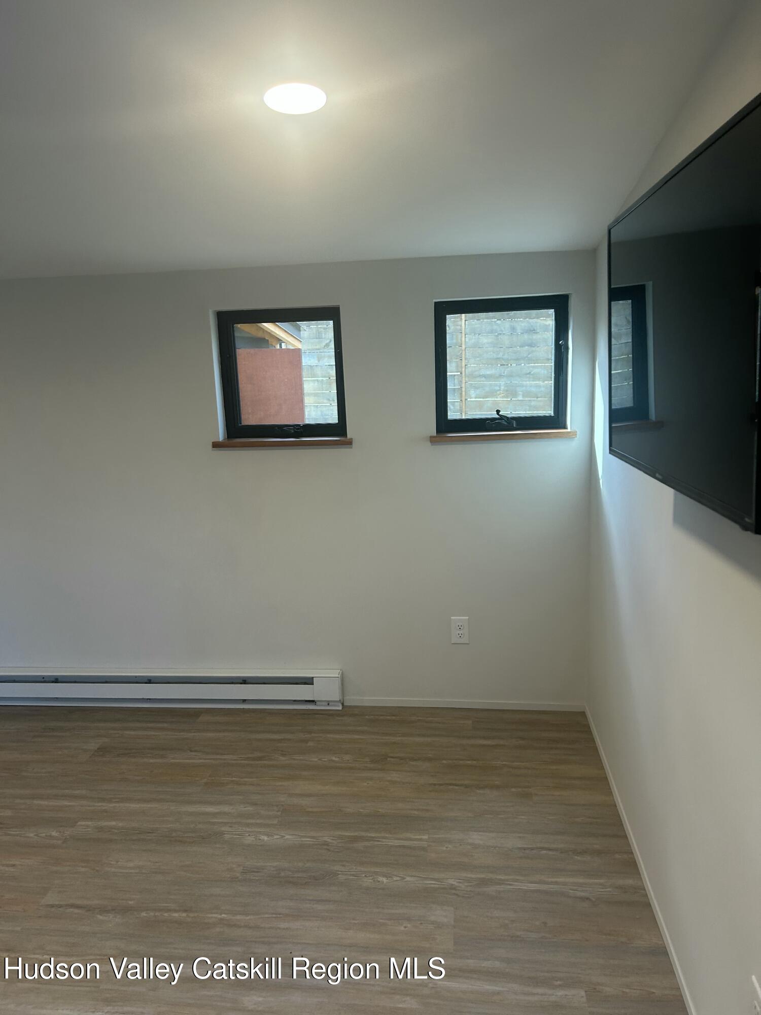 72 Forest Glen Road, Unit STUDIO Gardiner, NY 12561 - Photo 8 of 15 an empty room with an entryway