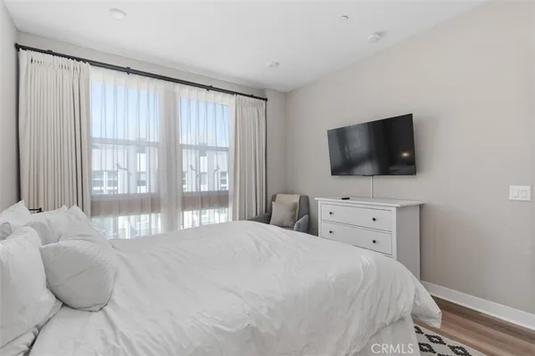 a spacious bathroom with stainless steel appliances a sink and a mirror