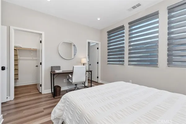a bathroom with a sink toilet vanity tub and shower