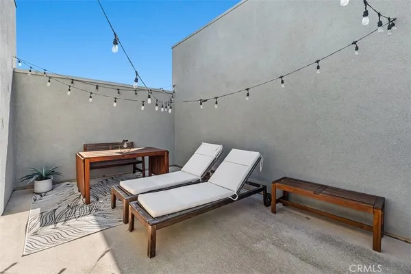 a living room with furniture a dining table and chairs