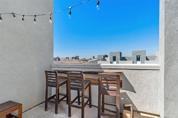 a view of a chairs and table in a patio