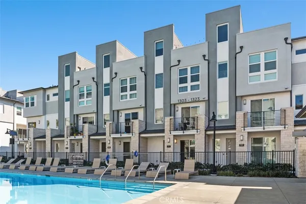 a swimming pool view with a outdoor seating space