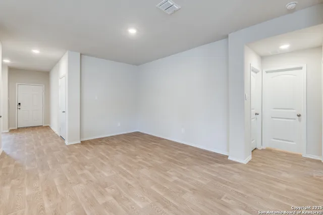 a view of kitchen with kitchen island granite countertop a stove top oven a sink and dishwasher
