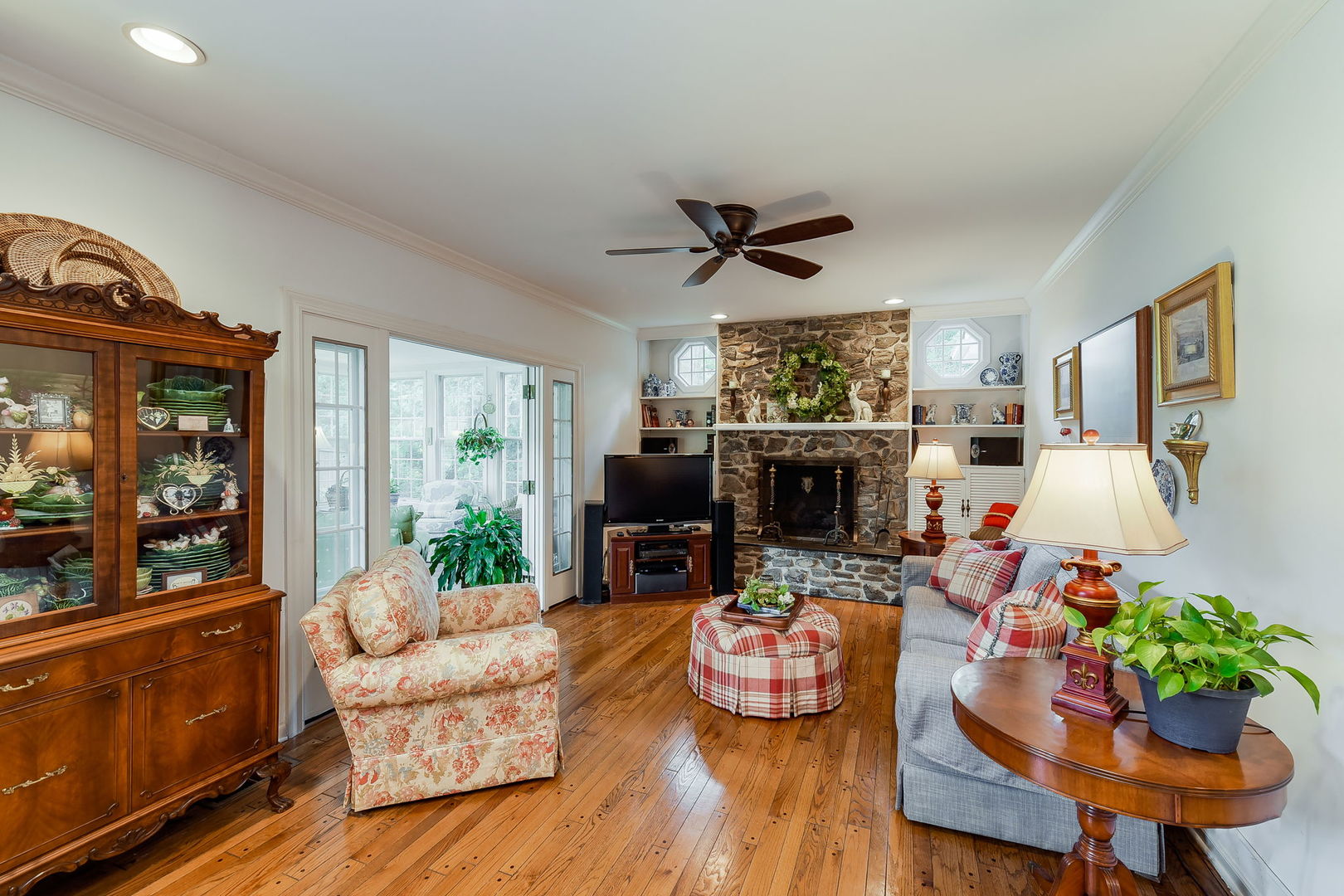1S771 Carrol Gate Road Wheaton, IL 60189 - Photo 14 of 42 a living room with fireplace furniture and a large window