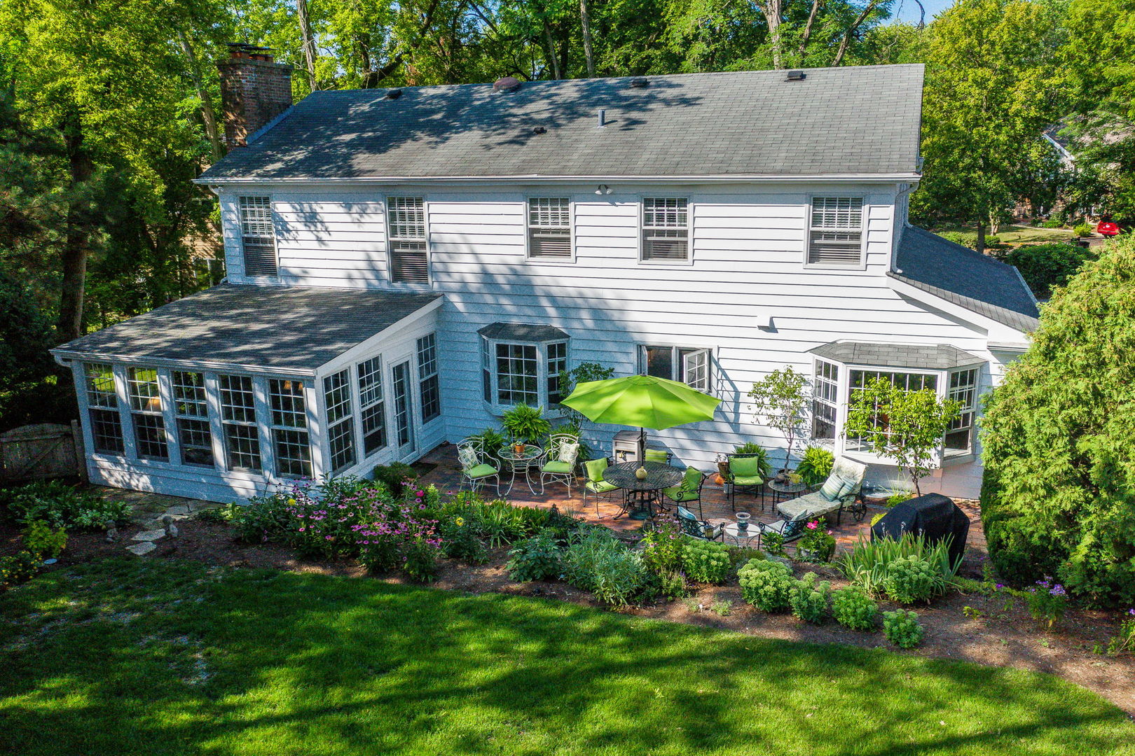 1S771 Carrol Gate Road Wheaton, IL 60189 - Photo 3 of 42 a view of a house with garden and plants