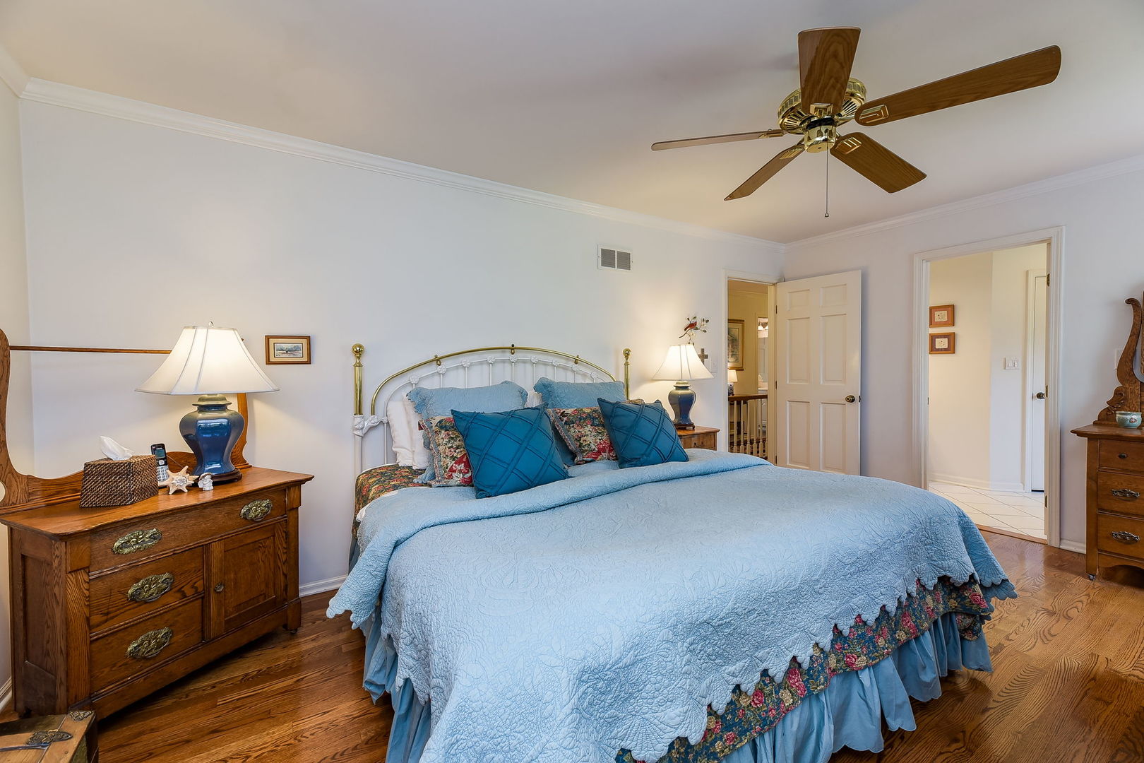 1S771 Carrol Gate Road Wheaton, IL 60189 - Photo 21 of 42 a bedroom with a bed and a chandelier