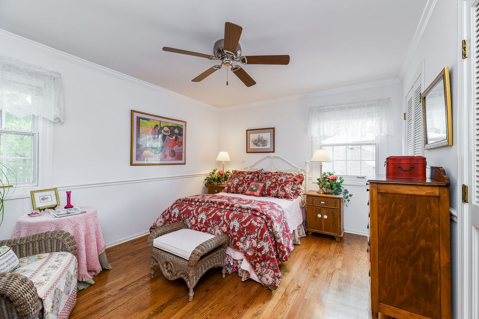 1S771 Carrol Gate Road Wheaton, IL 60189 - Photo 25 of 42 a bedroom with a bed and wooden floor