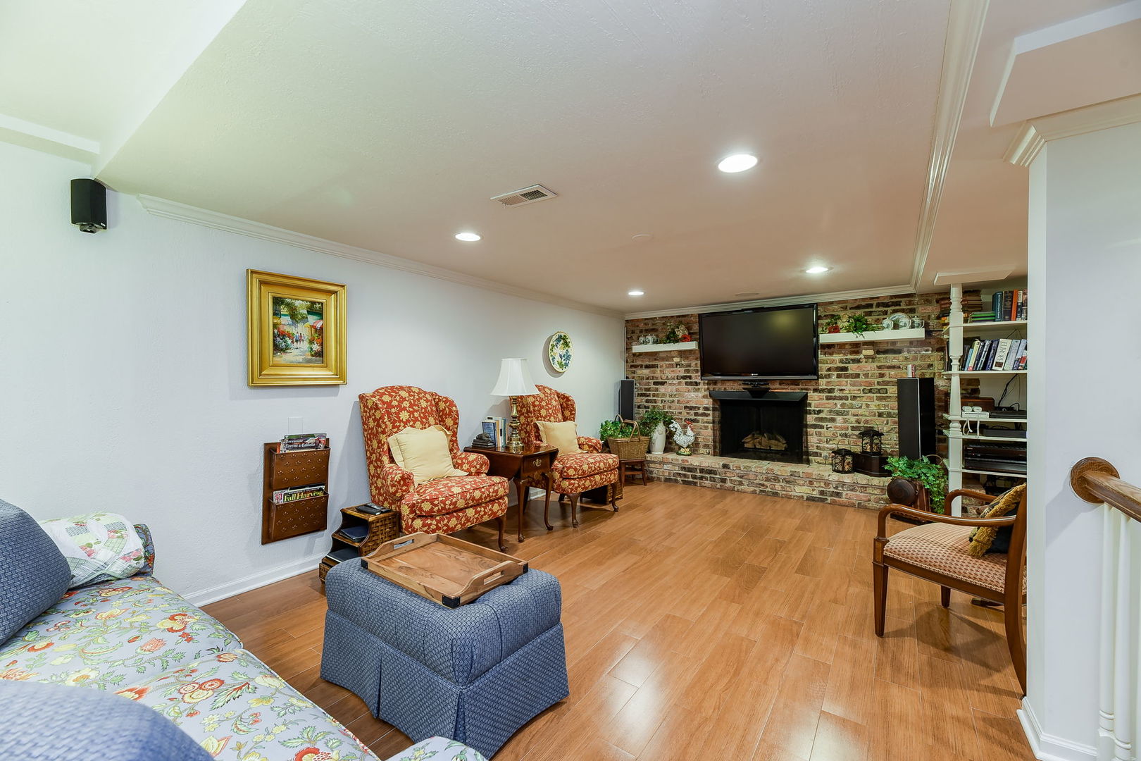 1S771 Carrol Gate Road Wheaton, IL 60189 - Photo 31 of 42 a living room with fireplace furniture and a flat screen tv