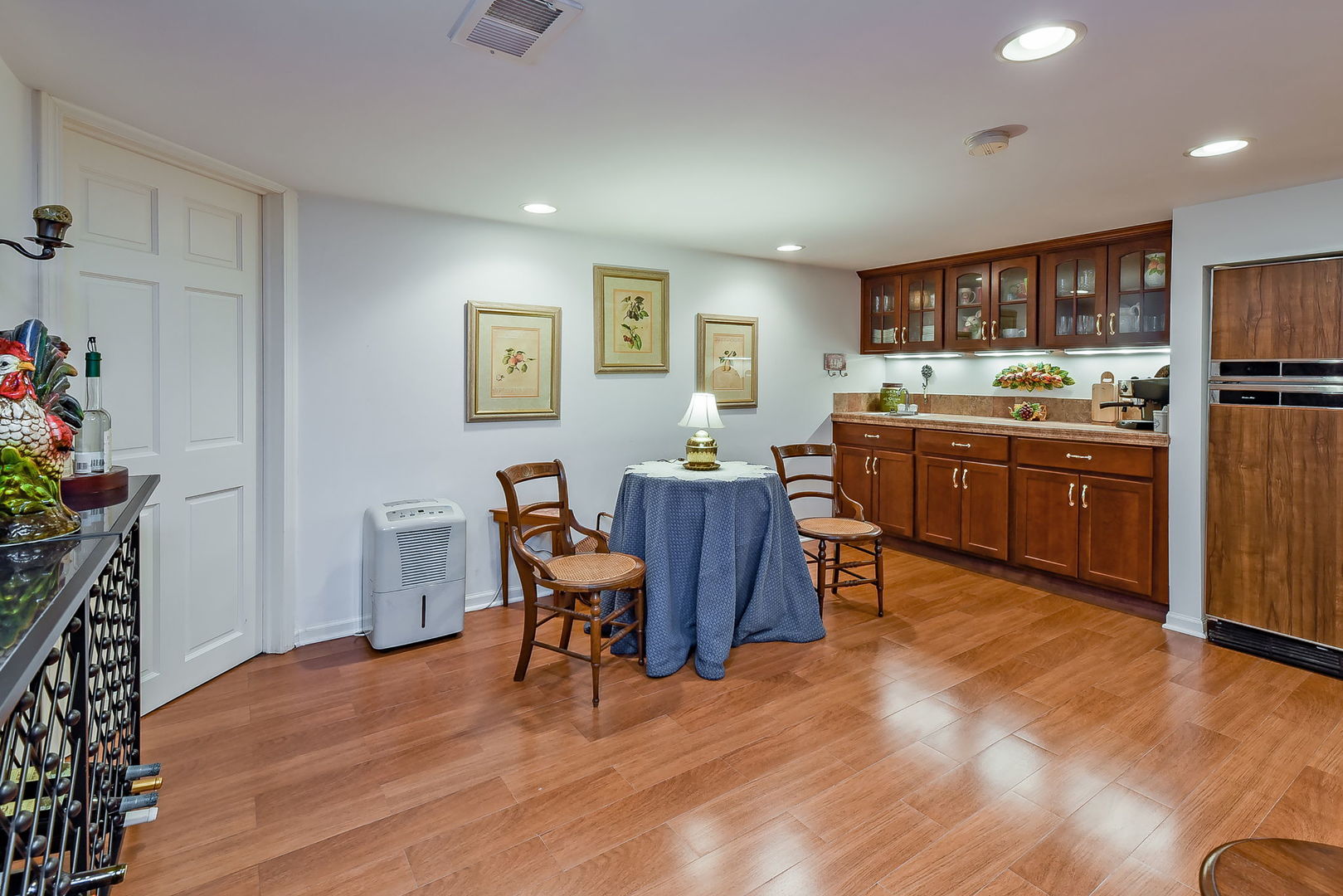 1S771 Carrol Gate Road Wheaton, IL 60189 - Photo 32 of 42 a view of a dining room with furniture and wooden floor