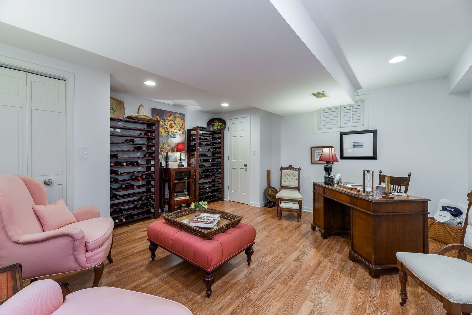 1S771 Carrol Gate Road Wheaton, IL 60189 - Photo 33 of 42 a room with furniture a rug and a bookshelf