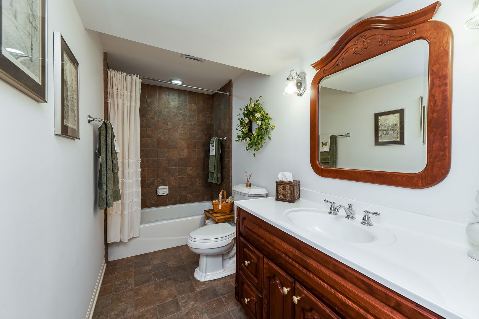1S771 Carrol Gate Road Wheaton, IL 60189 - Photo 35 of 42 a bathroom with a sink a toilet and shower