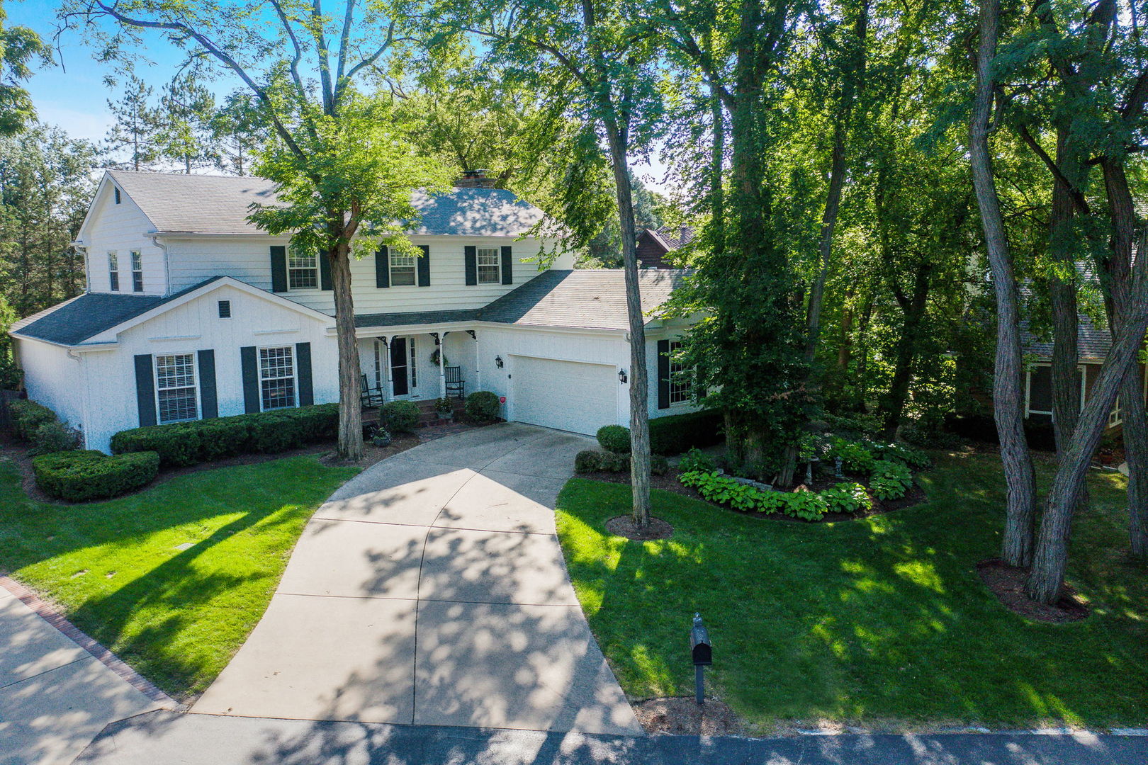 1S771 Carrol Gate Road Wheaton, IL 60189 - Photo 40 of 42 a front view of a house with garden