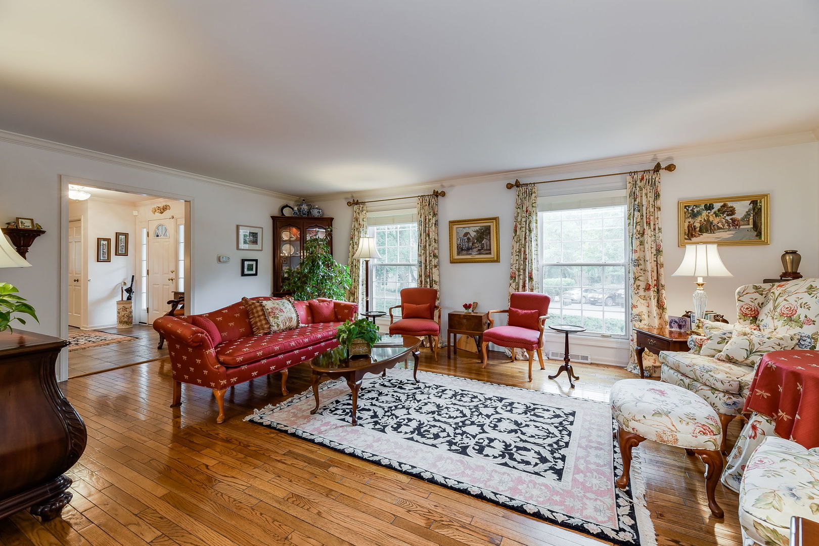 1S771 Carrol Gate Road Wheaton, IL 60189 - Photo 7 of 42 a living room with furniture a rug and a window