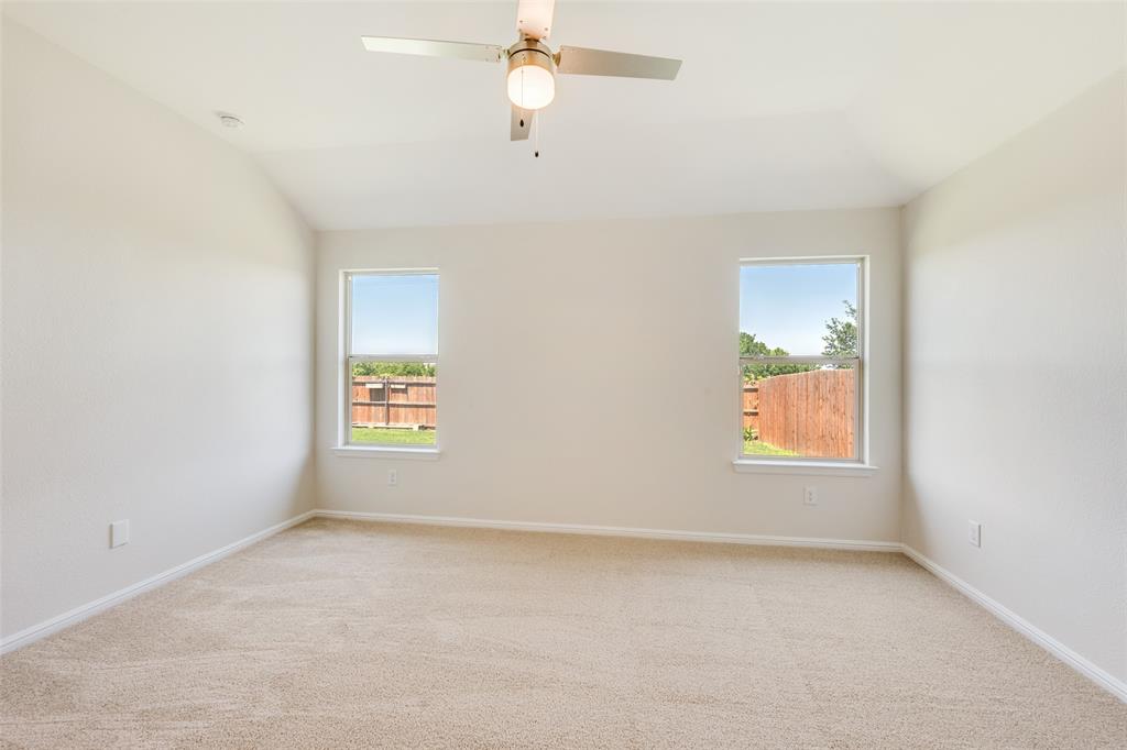857 Watson Way Crowley, TX 76036 - Photo 19 of 25 Vaulted ceiling featuring a ceiling fan with integrated lighting
