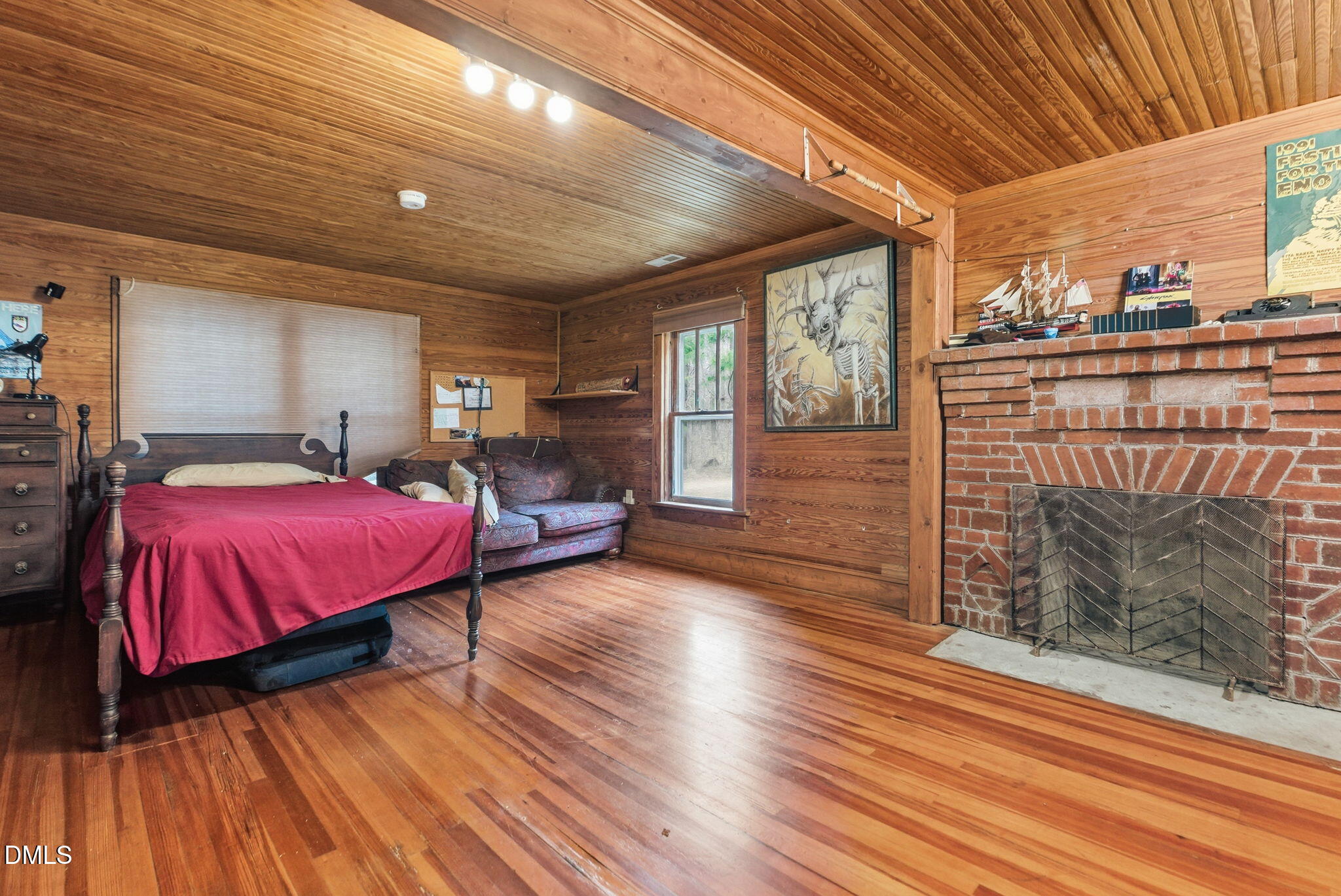 2319 White Cross Road Chapel Hill, NC 27516 - Photo 22 of 28 a spacious bedroom with a bed and wooden floor