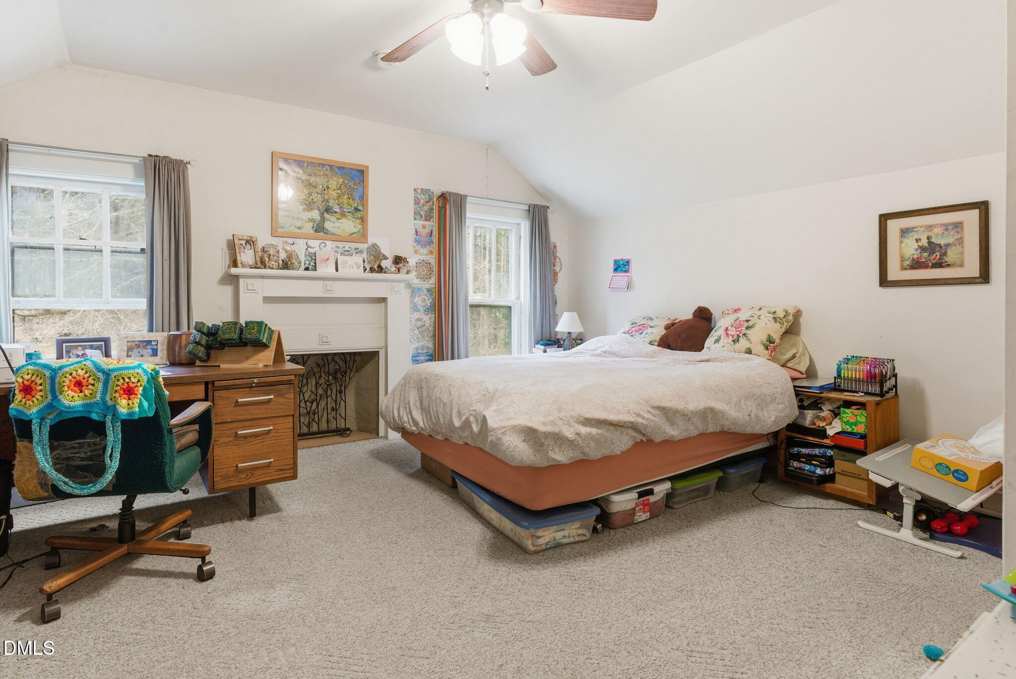 2319 White Cross Road Chapel Hill, NC 27516 - Photo 25 of 28 a bedroom with a bed and a chandelier