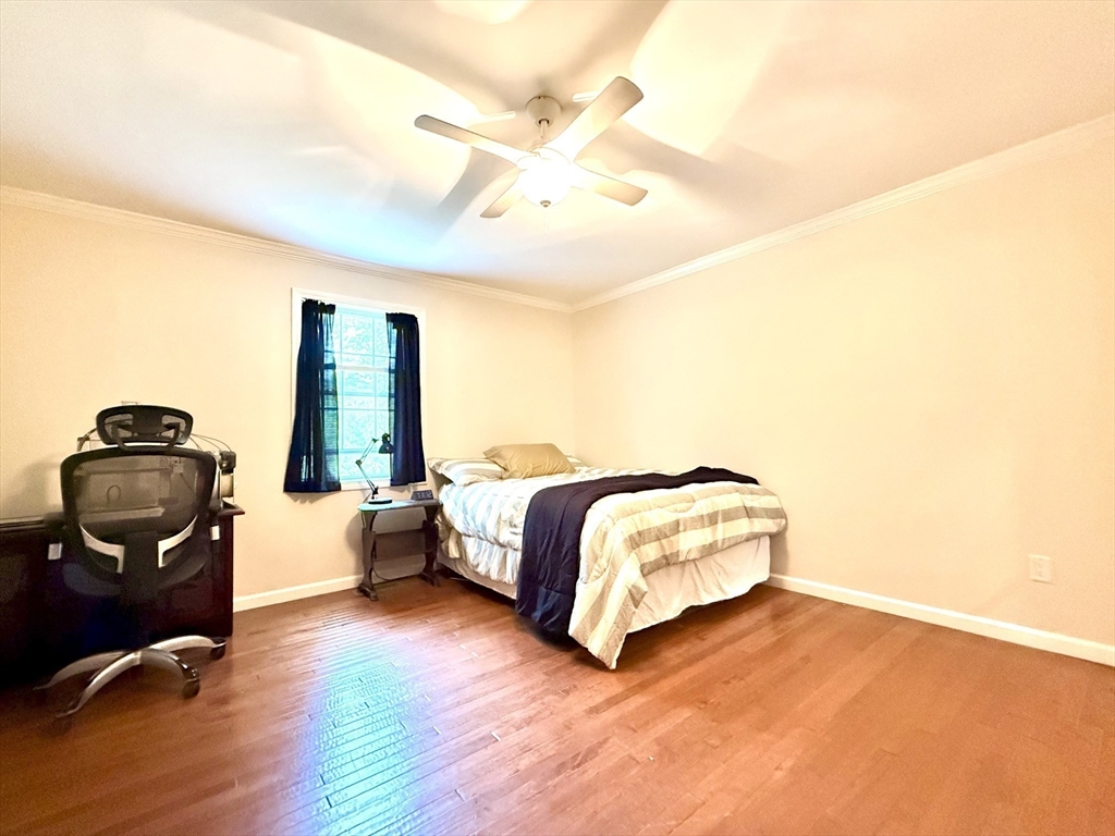 47 Old Chester Road Huntington, MA 01050 - Photo 17 of 36 a spacious bedroom with a bed and a chandelier