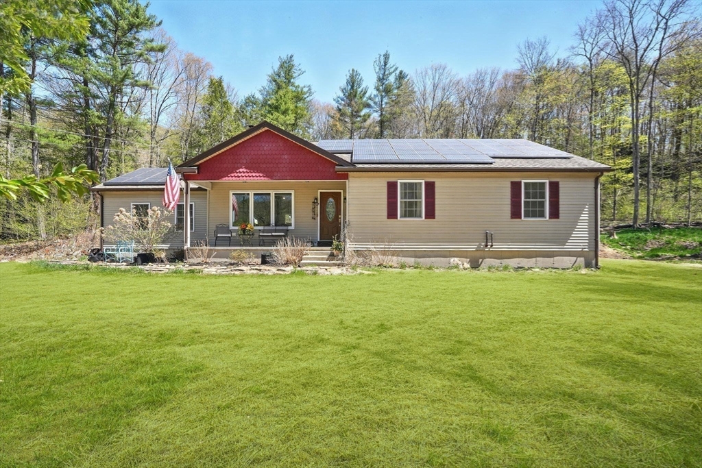 47 Old Chester Road Huntington, MA 01050 - Photo 22 of 36 a front view of a house with a yard
