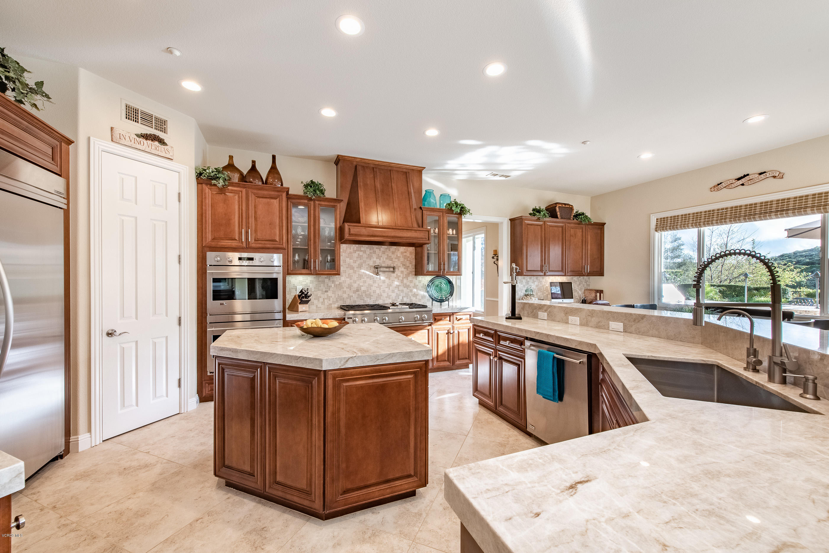 12354 Nelson Road Moorpark, CA 93021 - Photo 14 of 65 a kitchen with stainless steel appliances granite countertop a sink stove and refrigerator