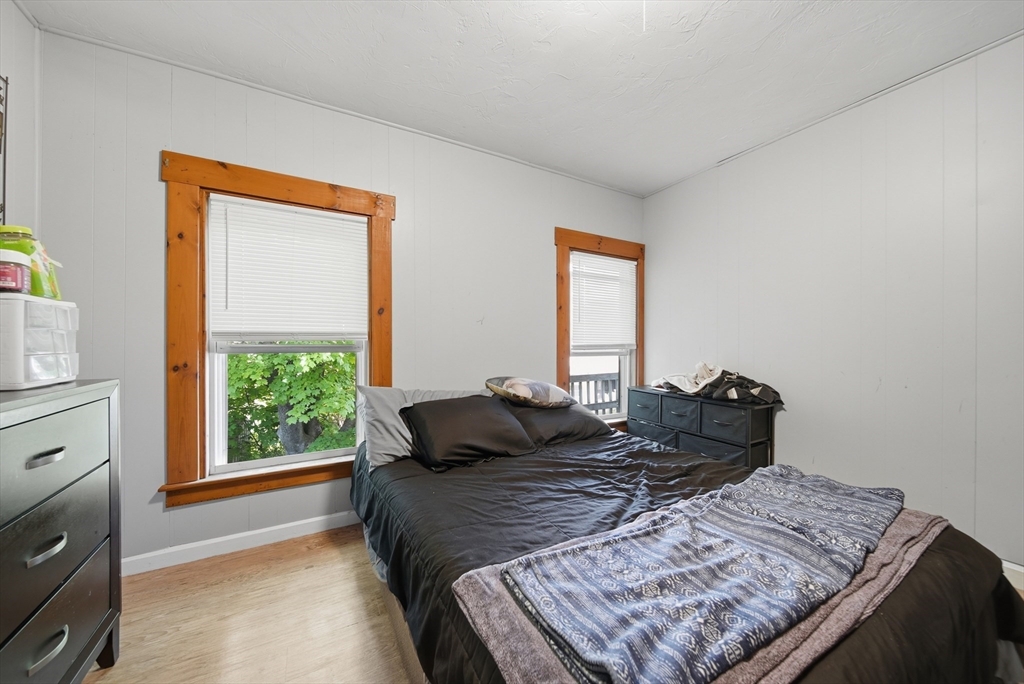 436 Franklin Road Fitchburg, MA 01420 - Photo 27 of 41 a bed sitting in a bedroom next to a window