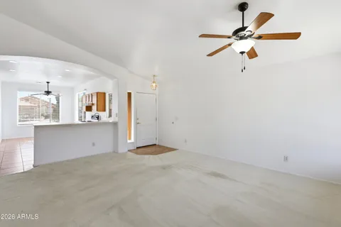 a kitchen with stainless steel appliances granite countertop a sink and a refrigerator