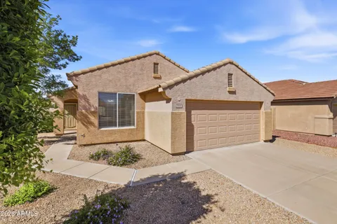 a front view of a house with a garage