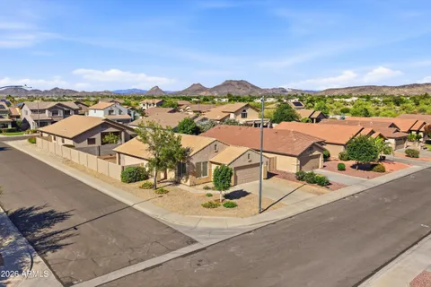 an aerial view of residential houses with outdoor space and river