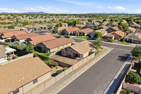 an aerial view of residential houses with outdoor space