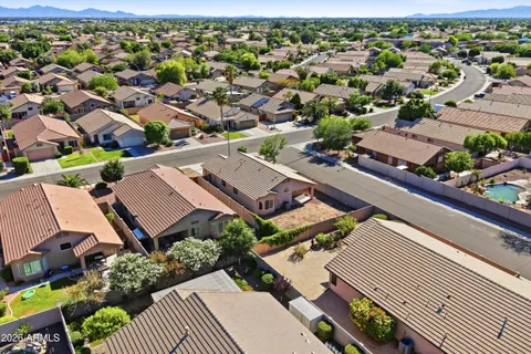 an aerial view of residential houses with outdoor space