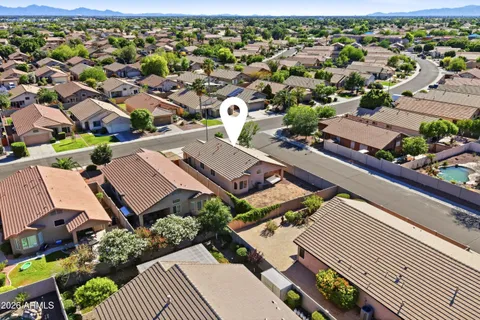 an aerial view of residential houses with outdoor space