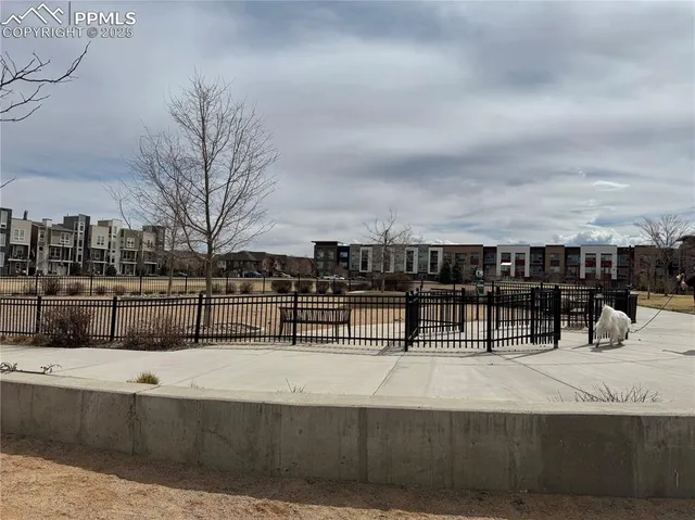 a view of fountain with a yard