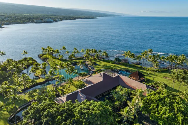an aerial view of a house with a lake view